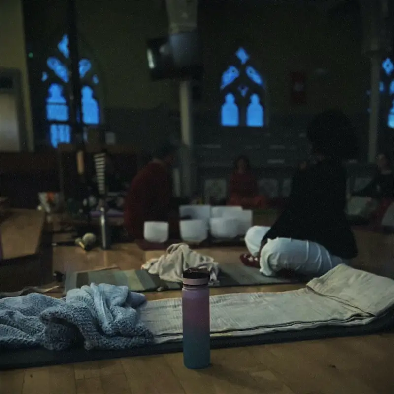 Participant view from a mat, bowls and people softly out of focus.